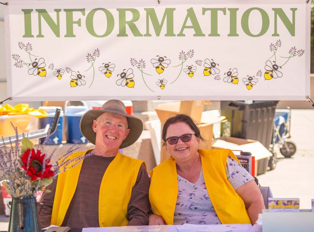 Festival staff sitting at information booth